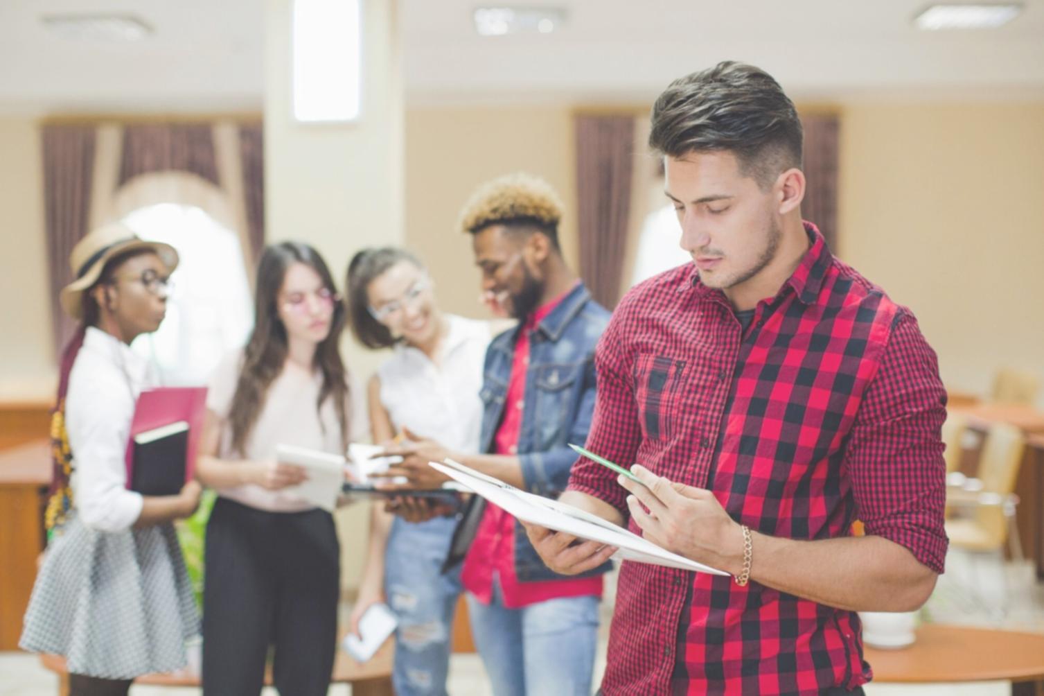 Team collaboration workspace with monitors showing SEO analytics and mobile optimization tools