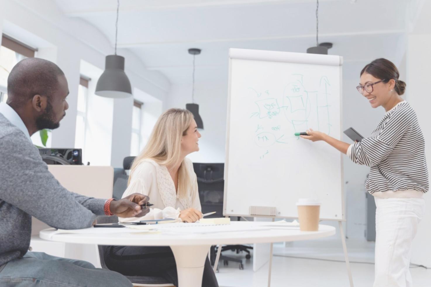Modern office workspace with natural lighting and comfortable seating areas for collaborative work